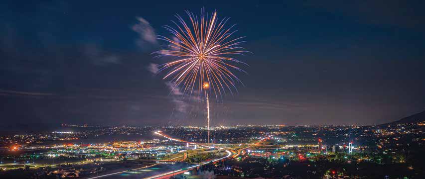 Fireworks over city lights