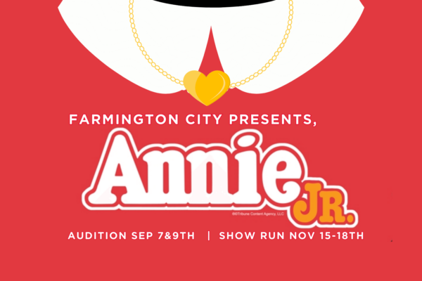 Red Annie Jr Flyer, close up of dress collar and heart shaped necklace