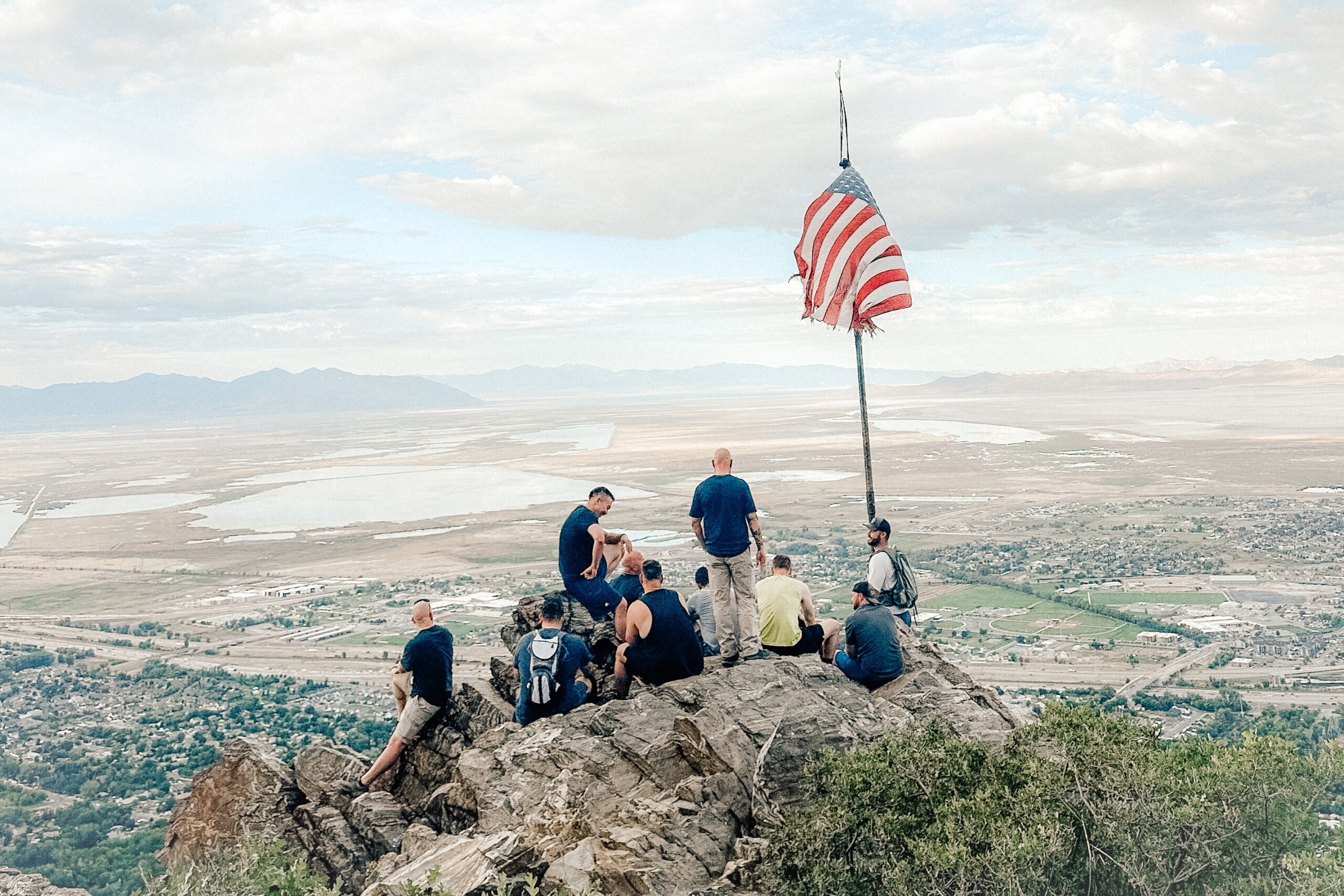 People surrounding American Flag